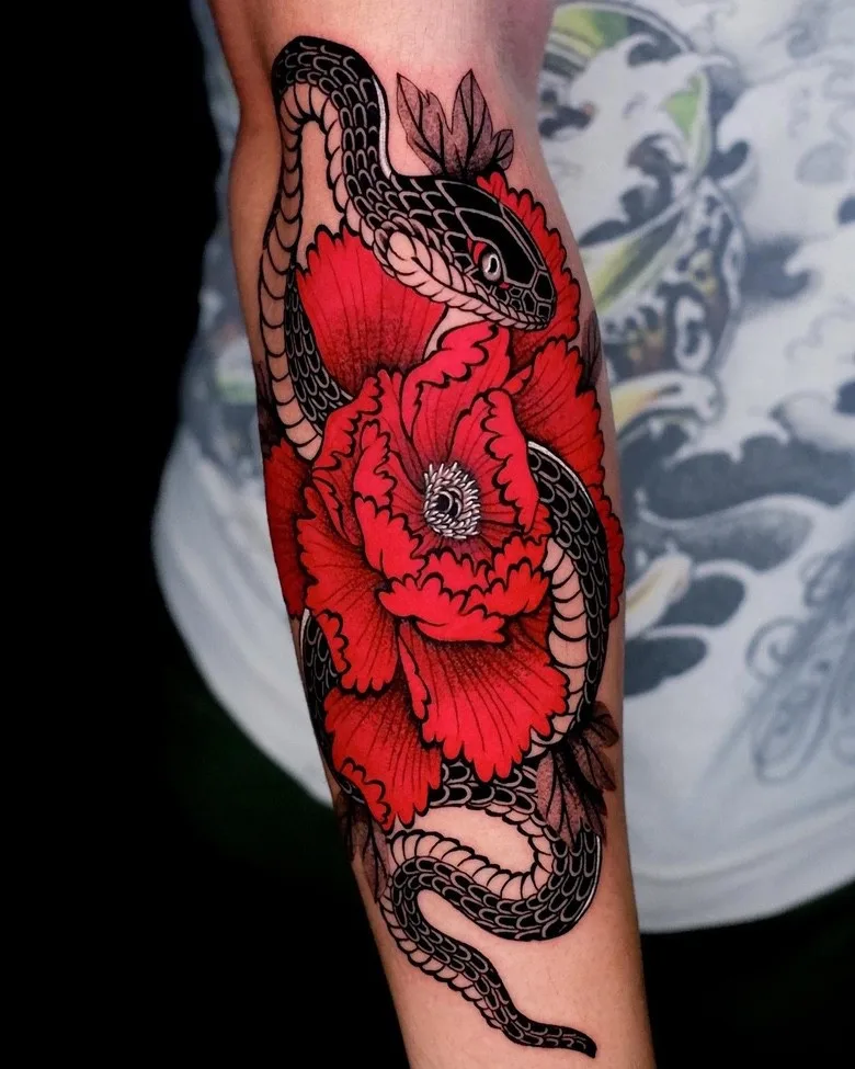 a snake in a flower Japanese style tattoo by Dino