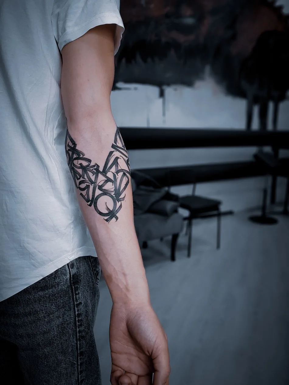 Tattoo artist Igor Klimin, color and black lettering, Calligraphy tattoo, NBK Tattoo Collective | Krasnodar, Russia