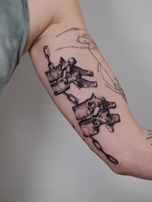 female black illustrative tattoo on biceps #95729 | Tattoo Artist Lisa Litovkin
