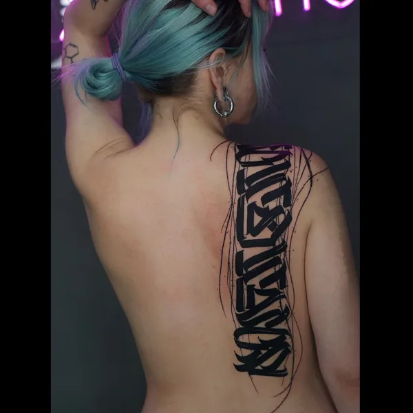 Calligraphy tattoo by Nikita Presnyakov in Tbilisi