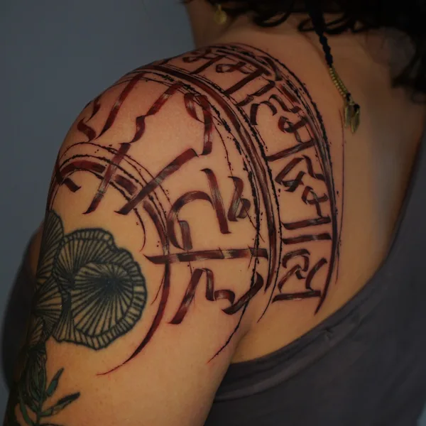Calligraphy tattoo by Nikita Presnyakov in Tbilisi