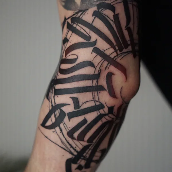 Calligraphy tattoo by Nikita Presnyakov in Tbilisi