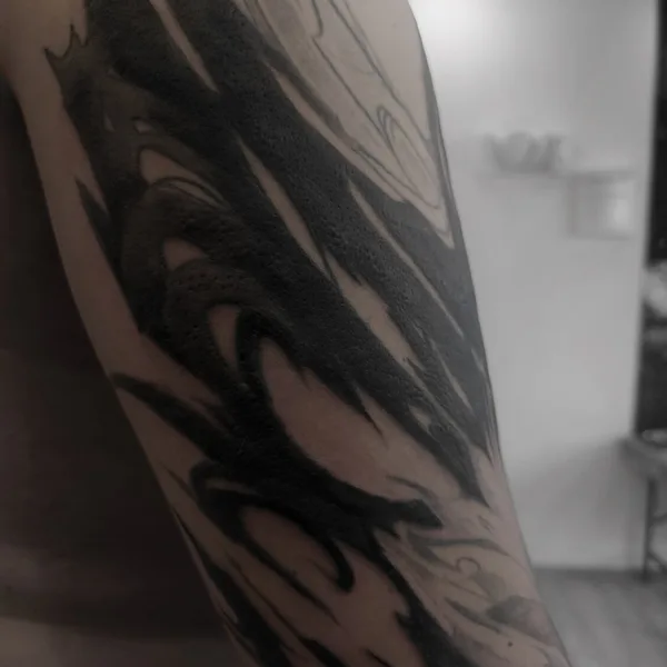 Lettering tattoo by Redz Roman in Shanghai