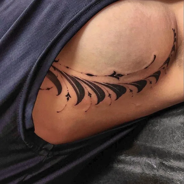 Graphic tattoo by Sergey Anuchin in Moscow