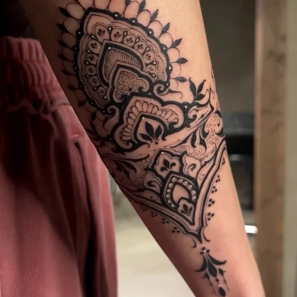 Graphic tattoo by Sergey Anuchin in Moscow