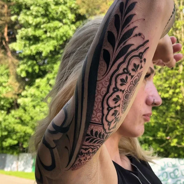 Graphic tattoo by Sergey Anuchin in Moscow