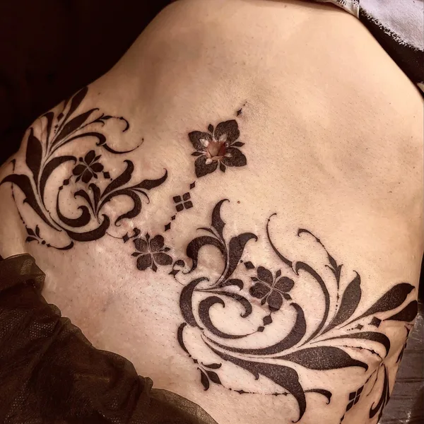 Graphic tattoo by Sergey Anuchin in Moscow