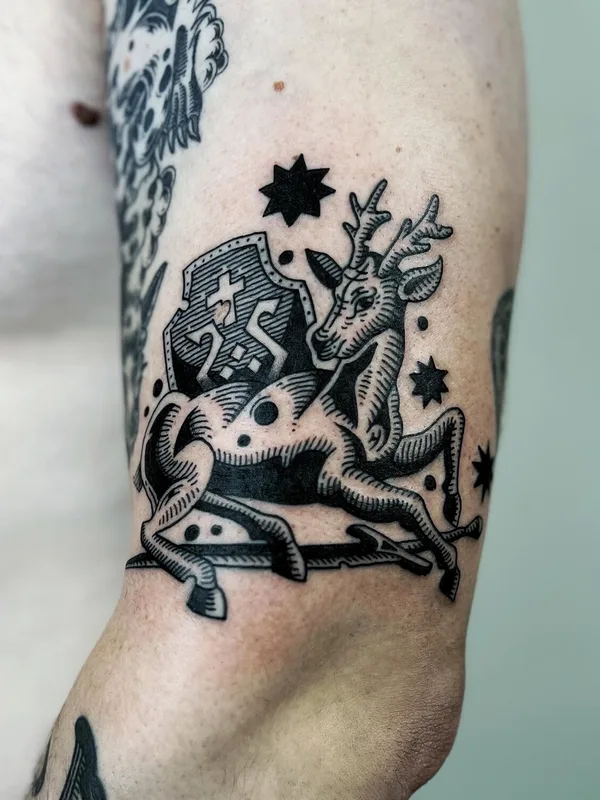 black and grey engraving Tatuaggio su bicep #99558 | Tatuatore Сева Назаров