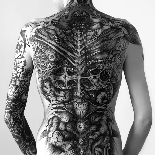 Abstract tattoo by Delphine CENCIG in Radanovići