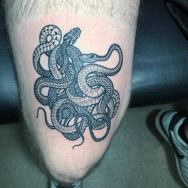 Blackwork Snake tattoo on Thigh