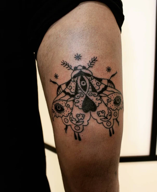 Blackwork Moth, Eye tattoo on Thigh
