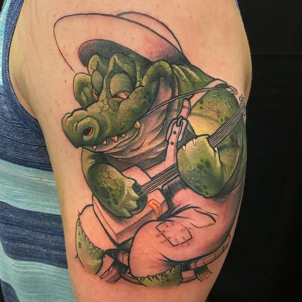 Cartoon Alligator, Musician tattoo on Upper Arm