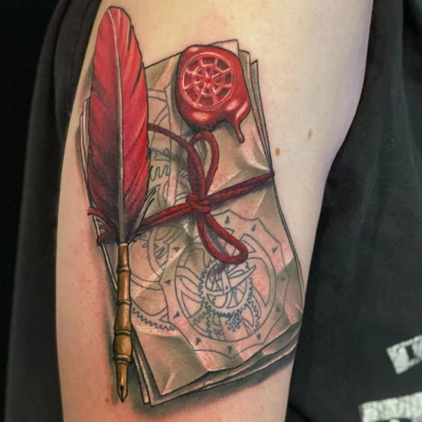 Illustrative Feather, Parchment tattoo on Upper Arm