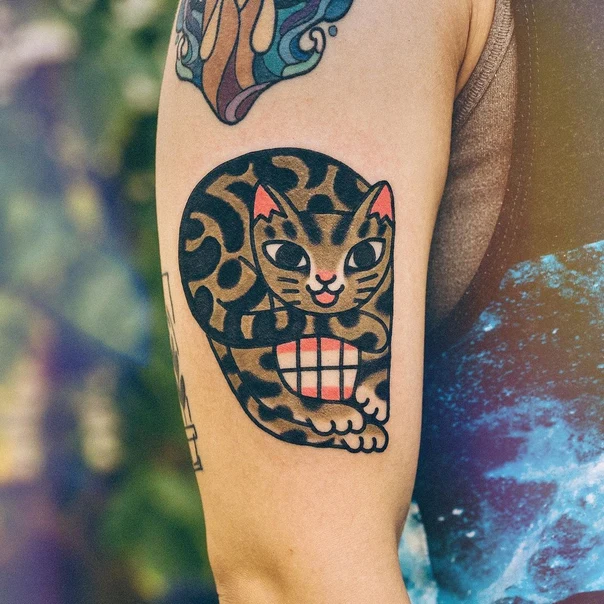Traditional Cat tattoo on Upper Arm