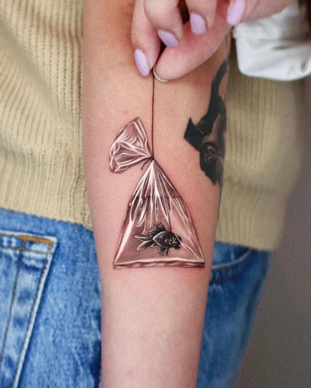 Realism Fish, Bag tattoo on Forearm