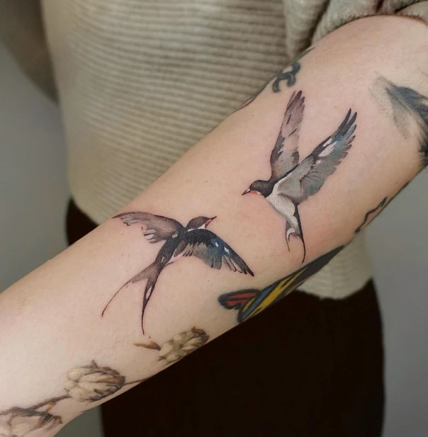 Watercolor Bird tattoo on Forearm