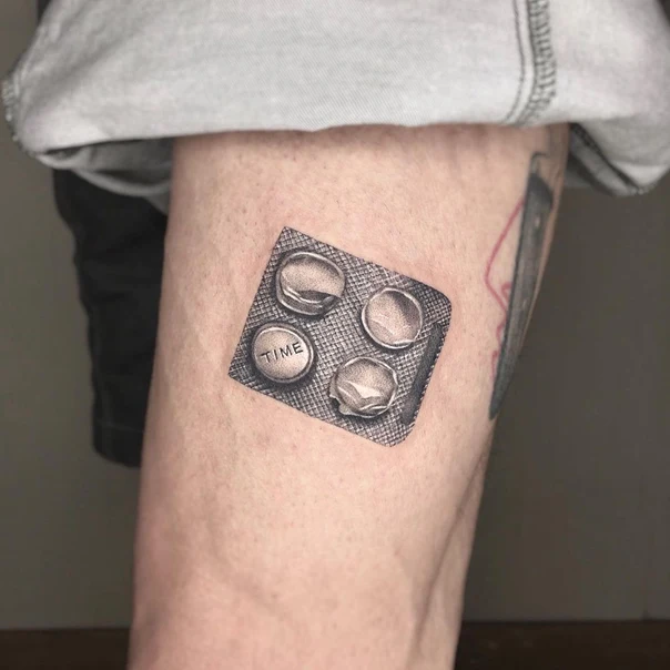 Realism Pills, Time tattoo on Thigh