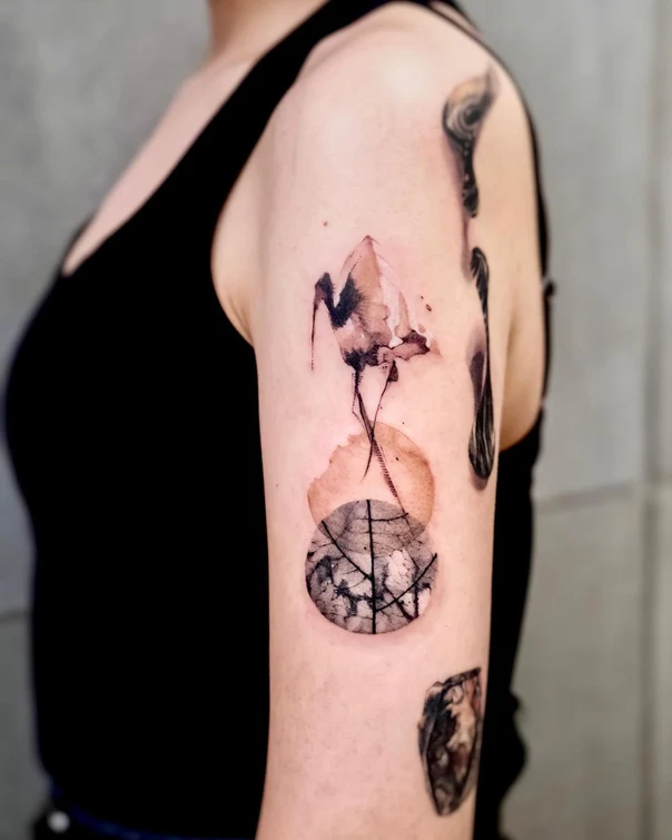 Watercolor Bird, Geometric tattoo on Upper Arm