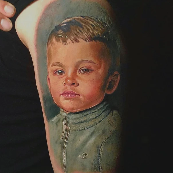 Realism Portrait tattoo on Upper Arm