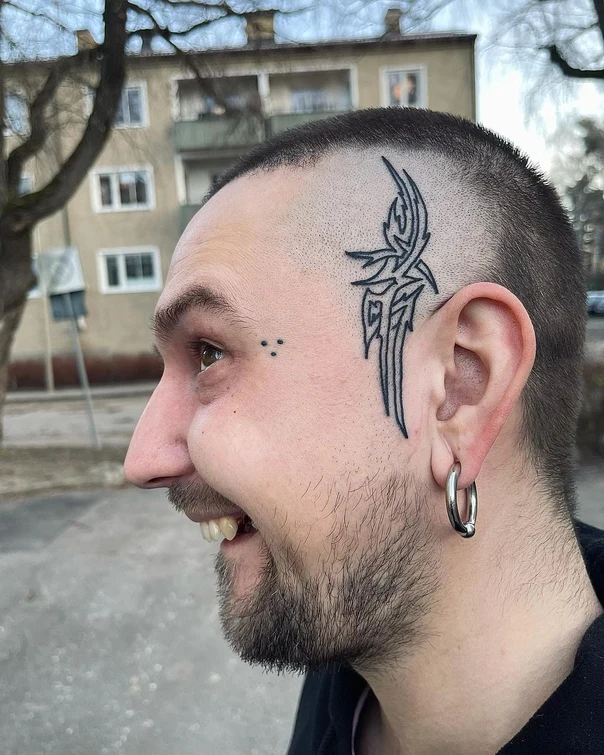 Tribal Abstract tattoo on Face