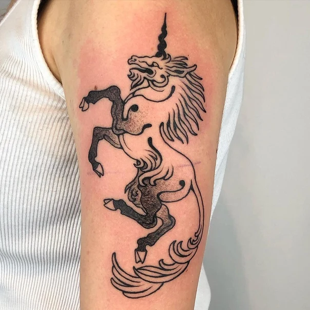 Linework Unicorn tattoo on Upper Arm