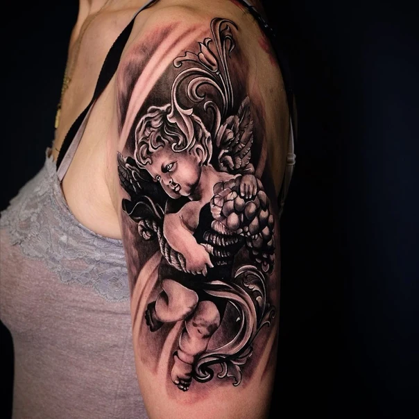 Realism Cherub, Floral tattoo on Upper Arm
