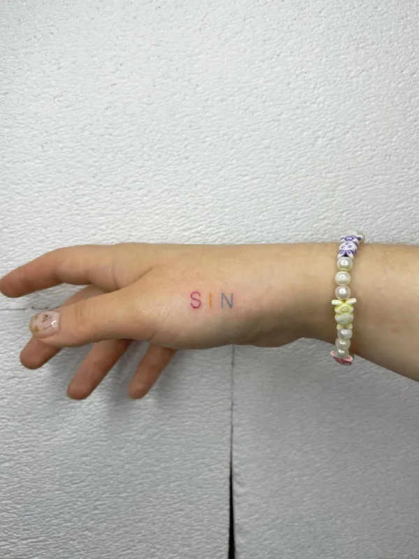 color lettering Tatuaggio su back of hand #48823 | Tatuatore Кристина Сидорова