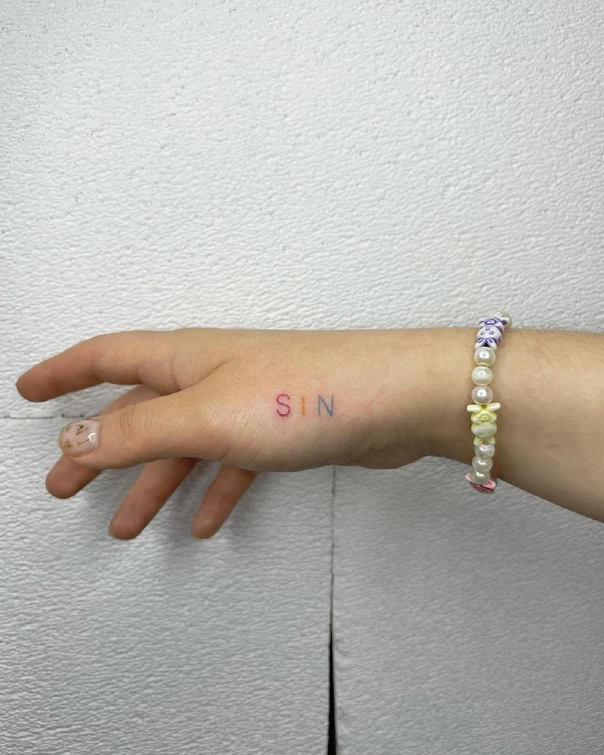Lettering Letters tattoo on Back of Hand