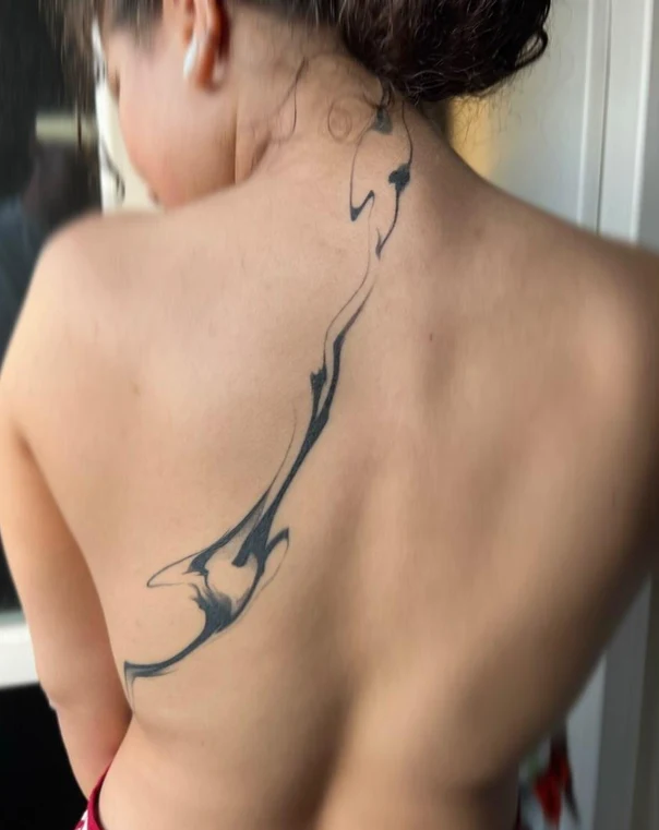Abstract tattoo on Upper Back