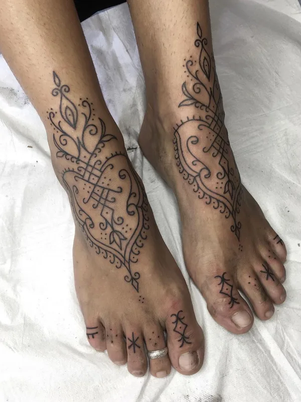 black ornamental tattoo on foot #63106 | Tattoo Artist Jon James Case