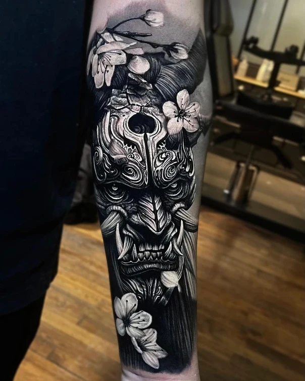 Japanese Oni mask, Cherry blossoms tattoo on Forearm