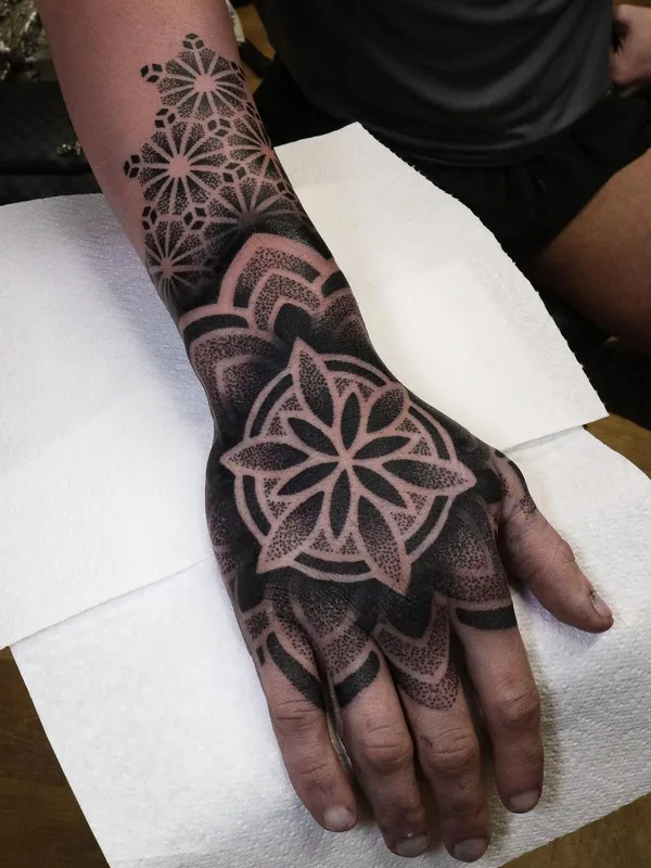 black blackwork tattoo on hand #63801 | Tattoo Artist @tommbirchtattoo