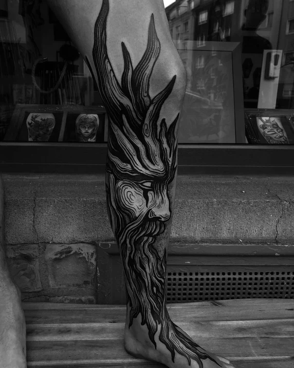 Blackwork Face, Tree tattoo on Calf