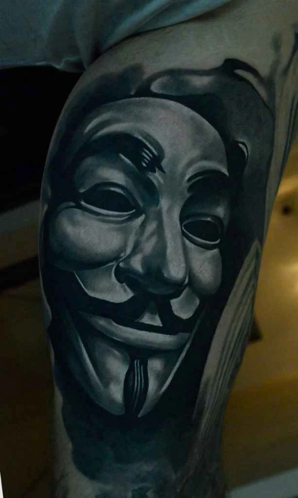 Black & Grey Mask tattoo on Thigh