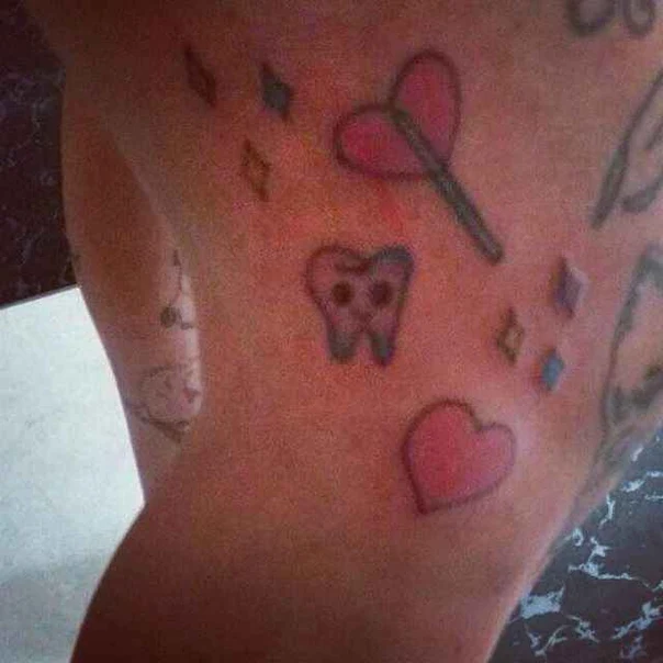 Illustrative Heart, Tooth tattoo on Shoulder