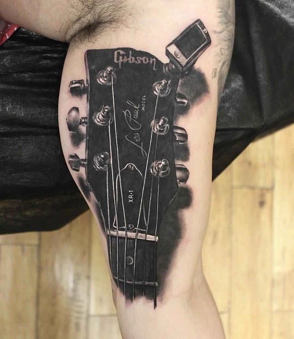 Black & Grey Guitar tattoo on Thigh