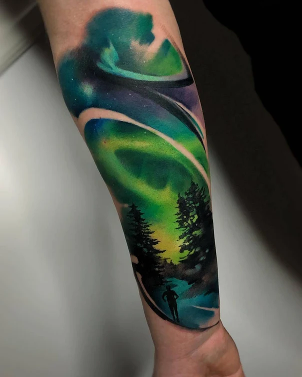 Watercolor Aurora borealis, Trees tattoo on Forearm