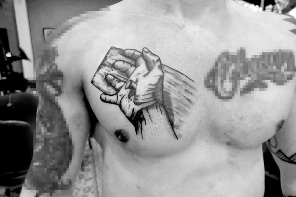 Blackwork Hand tattoo on Chest