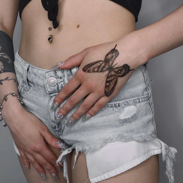 Linework Butterfly tattoo on Back of Hand