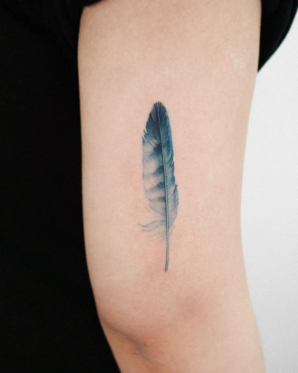 Watercolor Feather tattoo on Upper Arm