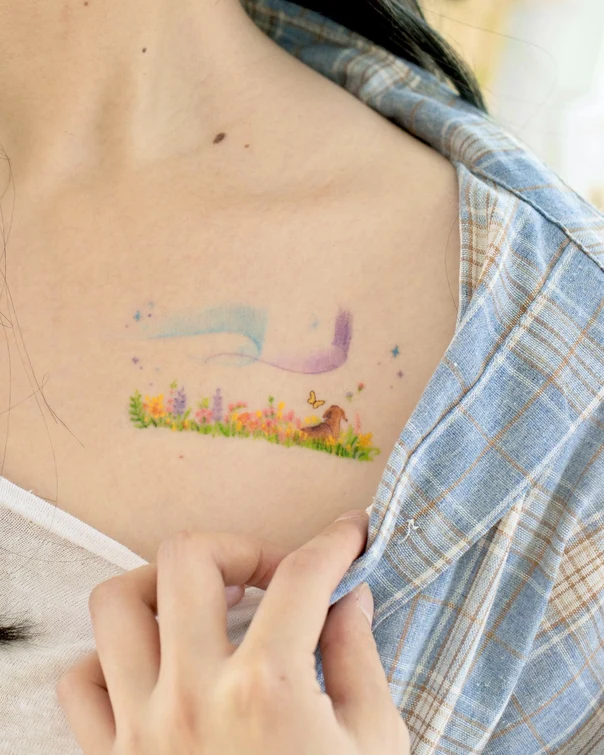 Illustrative Dog, Flowers tattoo on Collarbone