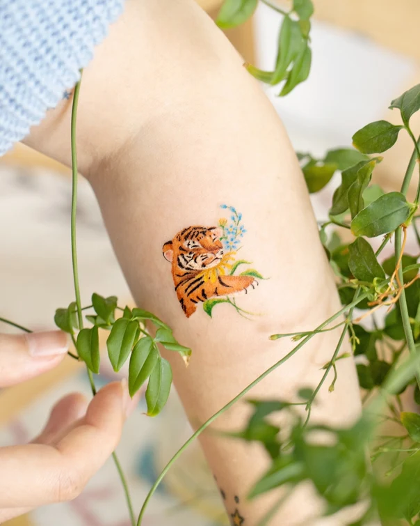 Illustrative Tiger, Flowers tattoo on Forearm