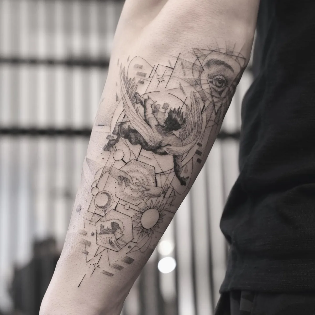 Tattoo on the arm from Misha Nechaev in the geometry tattoo style