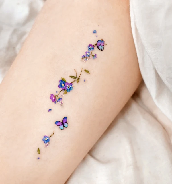 Fineline Butterfly, Flower tattoo on Thigh