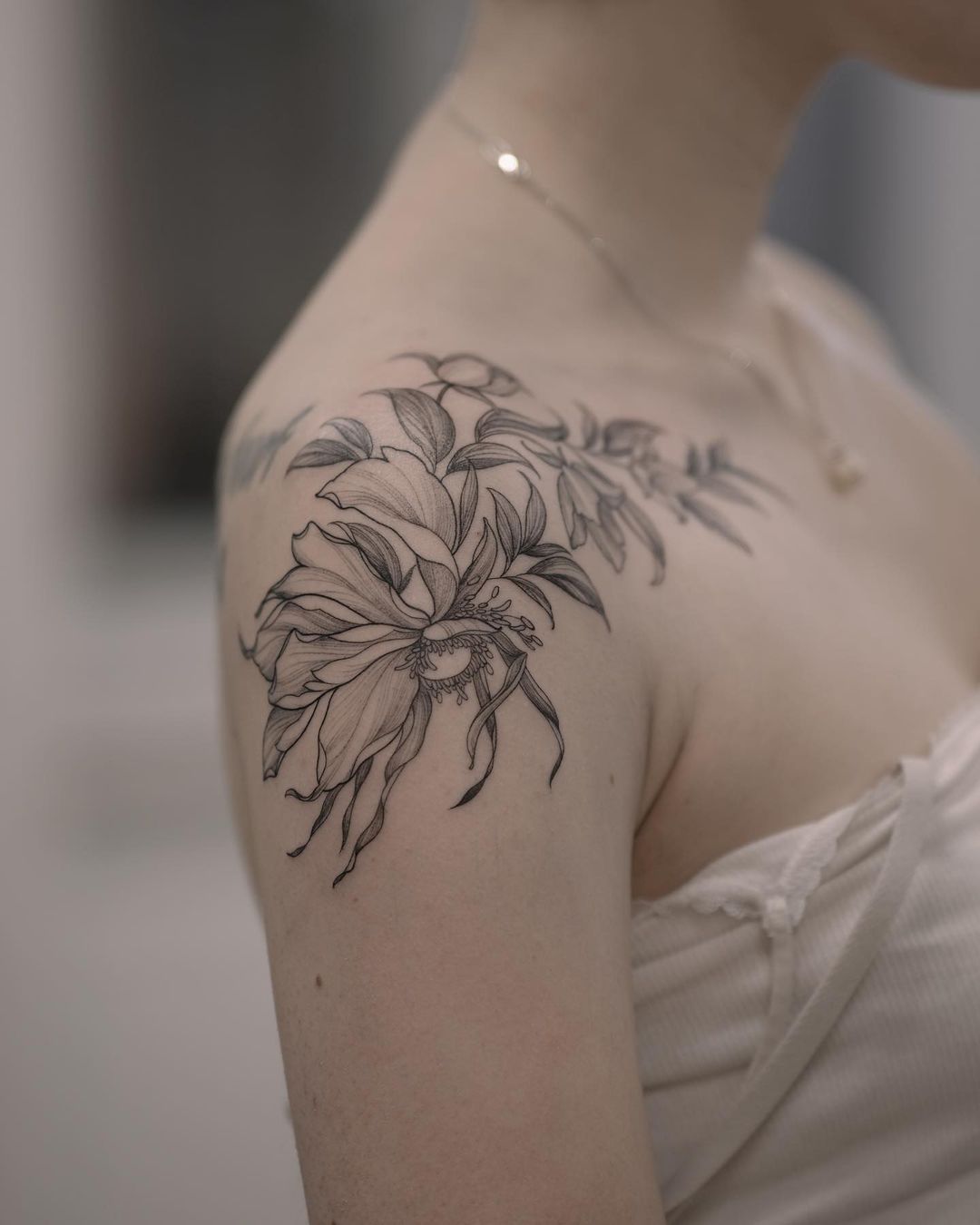 Delicate flowers tattoo on the arm - Tattoogrid.net