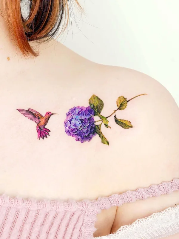 female color miniature tattoo on collarbone #53431 | Tattoo Artist Tilda Tattoo