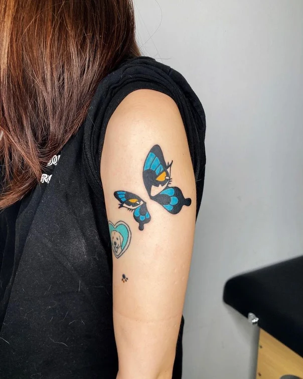 Illustrative Butterfly, Dog tattoo on Outer arm