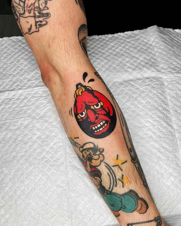 Traditional Face tattoo on Forearm