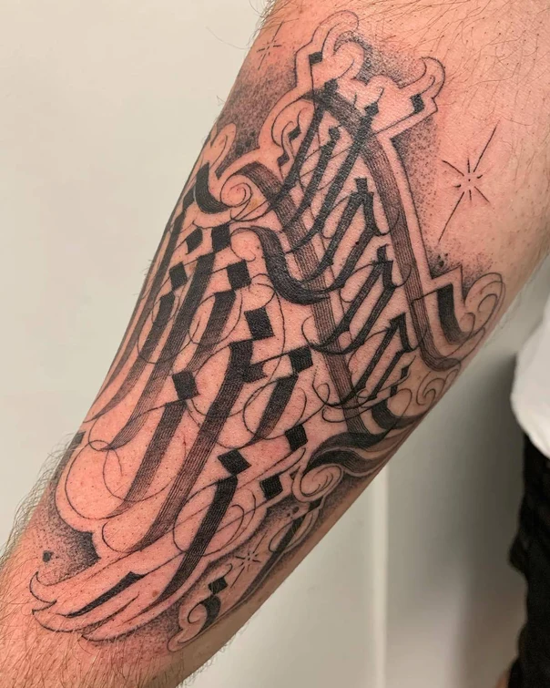 Calligraphy Lettering tattoo on Forearm