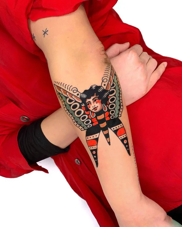 Traditional Butterfly, Face tattoo on Forearm
